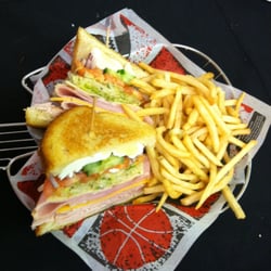 Aura Bistro - Signature Chef Salad Sandwich: Turkey, Ham, Swiss, Cheddar, Lettuce, Tomato, Cucumber, hard-boiled eggs on toasted sourdough.