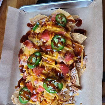 Oz Brewing - a tray of nachos on a table - Gastropubs Near Me - Phillipsburg, Kansas