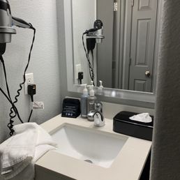 Sink and counter right outside of toilet door. Sink and counter right outside of toilet door.