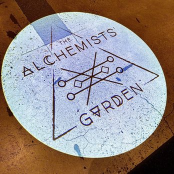 The Alchemists’ Garden - Projected light with logo on the floor as you enter. - Cocktail Bars Near Me - Paso Robles, California The Alchemists’ Garden - Projected light with logo on the floor as you enter. - Cocktail Bars Near Me - Paso Robles, California