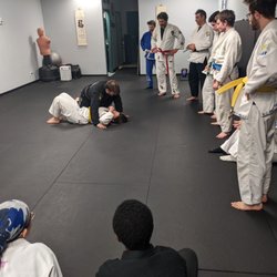 House of Combat - Our adult BJJ students watching Joel demonstrate and explained the details of a technique.