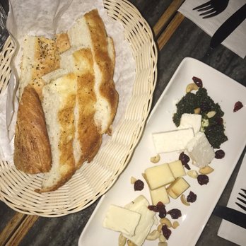 Pagliacci's - House bread with the The Men Who Called Goat Cheese (cheese platter) - Seafood Near Me - Victoria, British Columbia Pagliacci's - House bread with the The Men Who Called Goat Cheese (cheese platter) - Seafood Near Me - Victoria, British Columbia