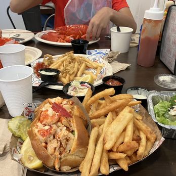 Rock Bottom Seafood - Lobster roll (L), fried clams (mostly eaten already), lobsters, clam chowder - Seafood Markets Near Me - Plymouth, Massachusetts Rock Bottom Seafood - Lobster roll (L), fried clams (mostly eaten already), lobsters, clam chowder - Seafood Markets Near Me - Plymouth, Massachusetts