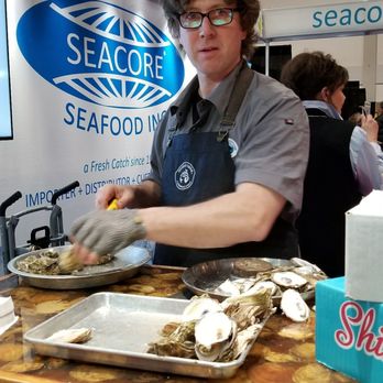 Seacore Seafood - a woman preparing food in a restaurant - Seafood Markets Near Me - Woodbridge, Ontario Seacore Seafood - a woman preparing food in a restaurant - Seafood Markets Near Me - Woodbridge, Ontario
