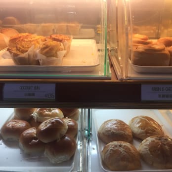 Fay Da Bakery - On top: coconut bun, raisin cheese bun. On the bottom taro bun and lemon puff - Bakeries Near Me - Flushing, New York