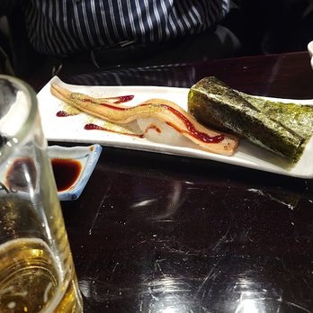 Gosuke - Another person's omakase. Salt water eel/anago and a tuna hand roll. - Japanese Near Me - New York, New York