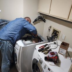 Master Appliance Repair - Replacing inlet water valve assembly on Maytag front loading washing machine.