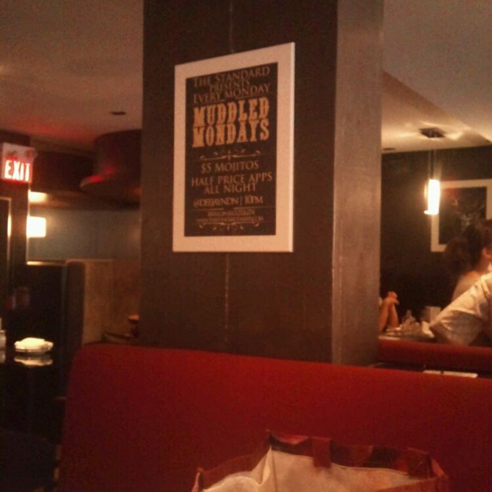 a man sitting at a table in a restaurant a man sitting at a table in a restaurant