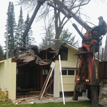 Nelson's Logging - a crane removing a house - Landscaping Near Me - Aitkin, Minnesota Nelson's Logging - a crane removing a house - Landscaping Near Me - Aitkin, Minnesota