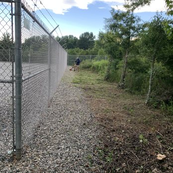 Rigid Property Maintenance - a chain link fence with a man walking in the distance - Pressure Washers Near Me Rigid Property Maintenance - a chain link fence with a man walking in the distance - Pressure Washers Near Me