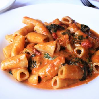 Carmelina's - Penne Capricciose  with Spinach, Roasted Red Peppers, Roasted Garlic, Tomato, & Cream Sauce - Italian Near Me - Boston, Massachusetts