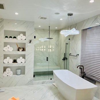 Builders Hub - Deluxe bathroom remodel for this master suite featuring floor to ceiling tile and a free standing bathtub. - General Contractors Near Me - Sherman Oaks, California Builders Hub - Deluxe bathroom remodel for this master suite featuring floor to ceiling tile and a free standing bathtub. - General Contractors Near Me - Sherman Oaks, California