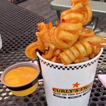 Curly Fries - a bucket of curly fries on a table - Juice Bars & Smoothies Near Me - Ocean City, New Jersey Curly Fries - a bucket of curly fries on a table - Juice Bars & Smoothies Near Me - Ocean City, New Jersey