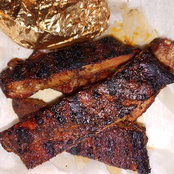 Woody's Bar-B-Q - ows two ribs and a potato - Barbeque Near Me - West Melbourne, Florida Woody's Bar-B-Q - ows two ribs and a potato - Barbeque Near Me - West Melbourne, Florida