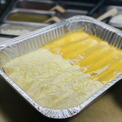 Neza Mexican Cuisine  - Enchiladas with sour cream sauce, and cheese