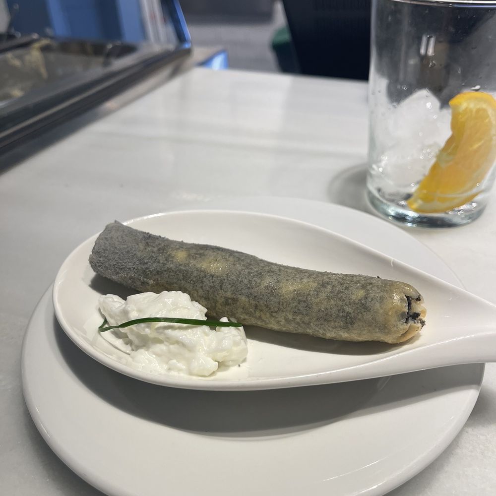 Eslava - Squid ink and bechamel mousse in a fried crepe "cigar" with whipped garlic! - Tapas Bars Near Me - Seville, SE Eslava - Squid ink and bechamel mousse in a fried crepe "cigar" with whipped garlic! - Tapas Bars Near Me - Seville, SE