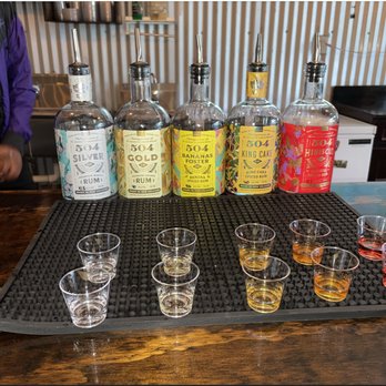 Happy Raptor Distilling - Rum Tastings. Silver, Gold, Bananas Foster, King Cake, & Hibiscus - Distilleries Near Me - New Orleans, Louisiana Happy Raptor Distilling - Rum Tastings. Silver, Gold, Bananas Foster, King Cake, & Hibiscus - Distilleries Near Me - New Orleans, Louisiana