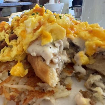 Nadeen's Hermitage Haven - The Kernel*  Hash browns, country sausage gravy over fresh made country biscuits with cheese whiz and fresh eggs. - Breakfast & Brunch Near Me - Hermitage, Tennessee