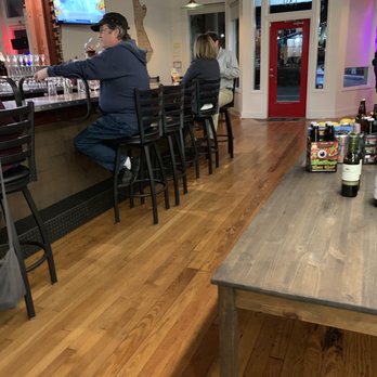 Libations On Chatham - people sitting at a bar - Wine Bars Near Me - Sanford, North Carolina