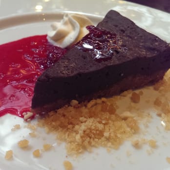 Jump Restaurant - Artisan Chocolate Marquise Cake salted hazelnut brittle, cherry compote - Canadian (New) Near Me - Toronto, Ontario Jump Restaurant - Artisan Chocolate Marquise Cake salted hazelnut brittle, cherry compote - Canadian (New) Near Me - Toronto, Ontario