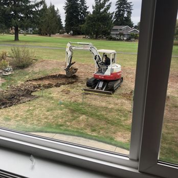 Landscape Pick Up - a small excavator digging a hole - Excavation Services Near Me Landscape Pick Up - a small excavator digging a hole - Excavation Services Near Me
