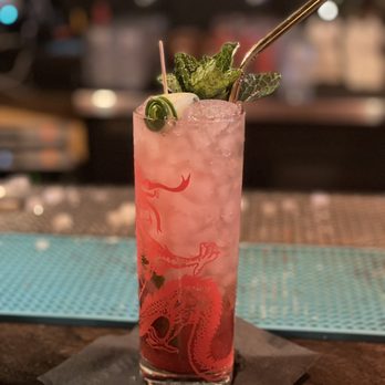 Chez Tao! - a drink with a straw and mint - Pan Asian Near Me - Quebec City, Quebec Chez Tao! - a drink with a straw and mint - Pan Asian Near Me - Quebec City, Quebec