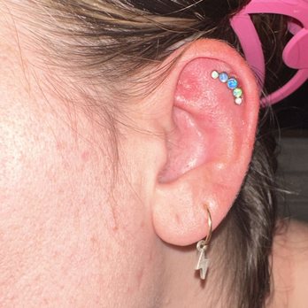 Modern Mods - Arrowhead  - Front of earring before removal - Piercing Near Me - Glendale, Arizona