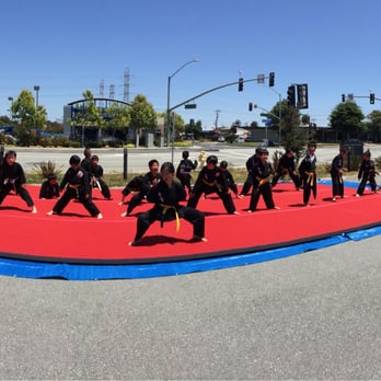 Burlingame Martial Arts - Samantha leading some of the young kids in their warm ups before demo time! - Martial Arts Near Me - Burlingame, California Burlingame Martial Arts - Samantha leading some of the young kids in their warm ups before demo time! - Martial Arts Near Me - Burlingame, California
