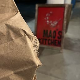 To go bag in front of Mao's Kitchen