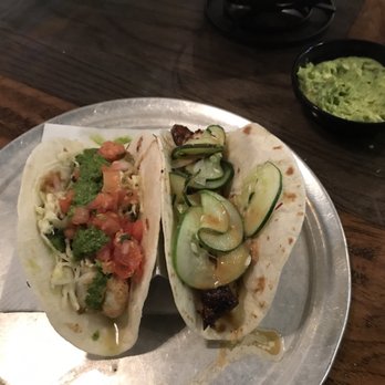 Bad Bean Baja Grill - Shrimp taco on the left, pork belly taco on the right, and guacamole. - Mexican Near Me - Kitty Hawk, North Carolina Bad Bean Baja Grill - Shrimp taco on the left, pork belly taco on the right, and guacamole. - Mexican Near Me - Kitty Hawk, North Carolina