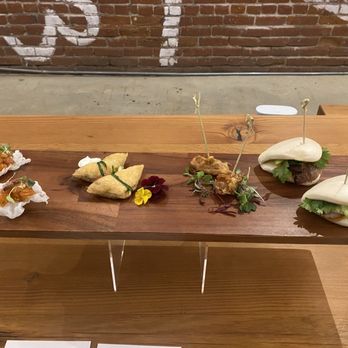 Chubby Fingers Catering - Sample appetizers from our tasting - salmon poke crisps, yubu soba pouch, korean fried chicken bite, char siu bao bun - Caterers Near Me