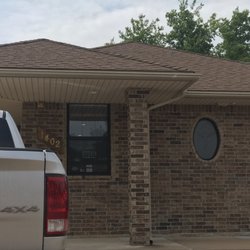 Lail Chiropractic Center - Front of building - blends in with the houses except it has a parking lot.