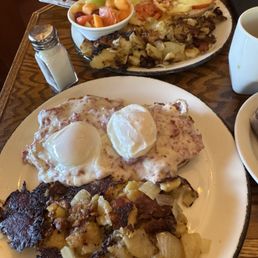 Top: Eggs Benedict, bottom: poached eggs on SOS over English muffins. Hash browns portion was very large and well done with onion in them.