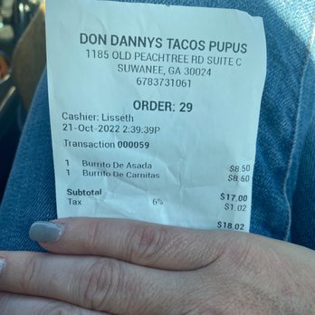 Don Dannys Tacos Pupus - a person's hand holding a don don don don don don don don don don don don - Mexican Near Me - Suwanee, Georgia