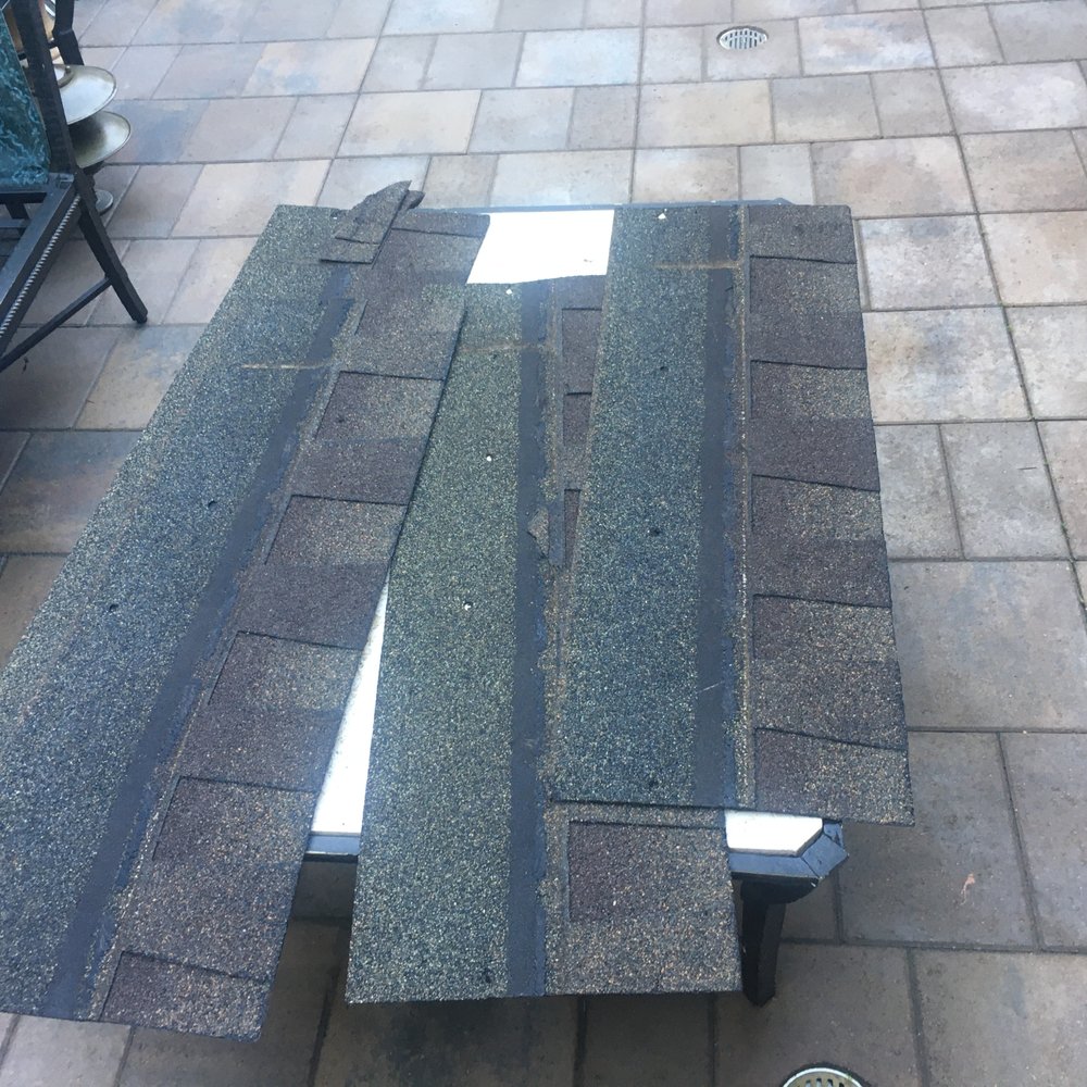 Becker Enterprises - Photos of old shingles showing locations of nail holes" in the incorrect area of the shingle. - General Contractors Near Me - Northridge, California