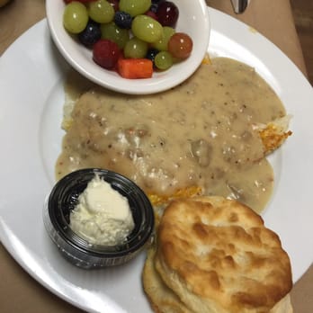 Red Rooster Cafe - Hashbrown casserole substituted with sausage gravy, side of fruit and biscuit. - Breakfast & Brunch Near Me - Destin, Florida