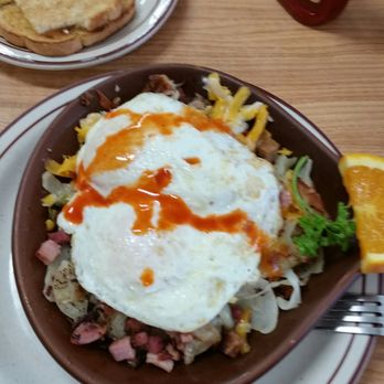 Lorene's Downtown - Meat lovers skillet with eggs over easy and a dash of hot sauce. It's enough to make a vegetarian cringe with its tumny, meaty goodness. - Diners Near Me - Bakersfield, California Lorene's Downtown - Meat lovers skillet with eggs over easy and a dash of hot sauce. It's enough to make a vegetarian cringe with its tumny, meaty goodness. - Diners Near Me - Bakersfield, California
