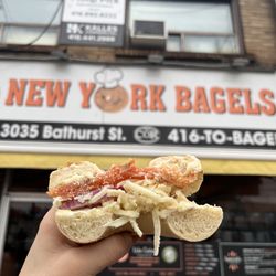 Bubby's Bagels - Lox bagel topped with cream cheese, red onion and Parmesan cheese shards