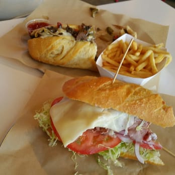 BRONX Sandwich - This is a half eaten Philly Cheese and half of a Roast beef with avocado. - Sandwiches Near Me - Anaheim, California
