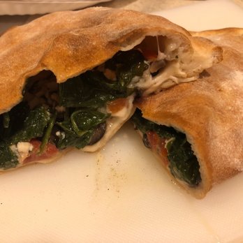 Pienezza Pizza - Calzone with spinach, mushrooms and fresh tomatoes! Delish! - Pizza Near Me - Kissimmee, Florida Pienezza Pizza - Calzone with spinach, mushrooms and fresh tomatoes! Delish! - Pizza Near Me - Kissimmee, Florida