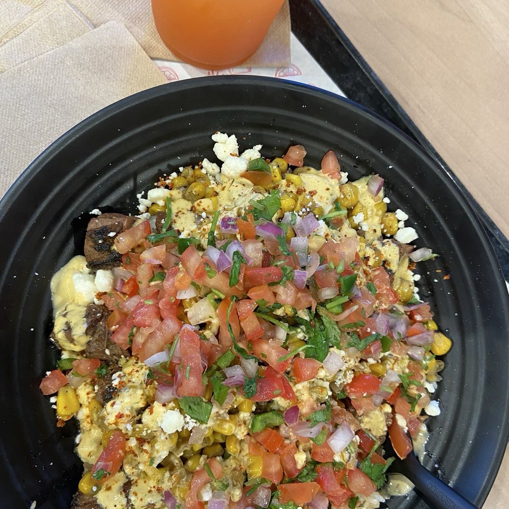 Elote Bowl with carne asada & strawberry, pineapple, jalapeño limeade Elote Bowl with carne asada & strawberry, pineapple, jalapeño limeade