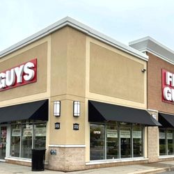 Five Guys - An exterior photograph of the Five Guys restaurant at 3732 Innes Road in Orleans, Ontario, Canada.