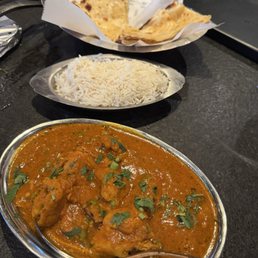Chicken curry (dark meat) with high spice. Their awesome rice and delicious cheesy naan. Chicken curry (dark meat) with high spice. Their awesome rice and delicious cheesy naan.