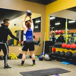 Anytime Fitness - While doing a photoshoot for the owner of the gym I personally witnessed Fitness Trainer Brandi Jackson very focused and hard at work.