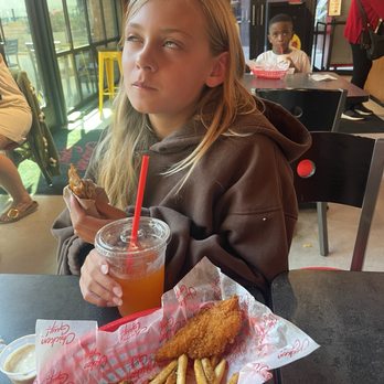 Chicken Guy! - Kids 2-piece meal and a kid throughly enjoying her tenders. - Sandwiches Near Me - Los Angeles, California Chicken Guy! - Kids 2-piece meal and a kid throughly enjoying her tenders. - Sandwiches Near Me - Los Angeles, California