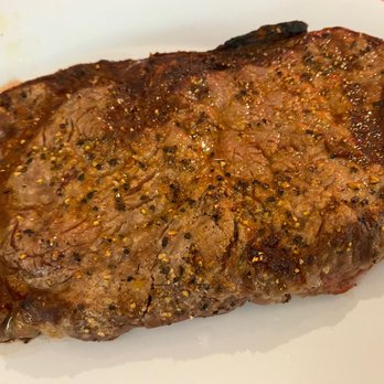 5ive Steak - a piece of steak on a white plate - Steakhouses Near Me - Jamaica, New York 5ive Steak - a piece of steak on a white plate - Steakhouses Near Me - Jamaica, New York