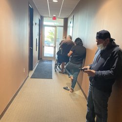 Clinical Pathology Laboratories - Multiple people waiting in line to get lab work.