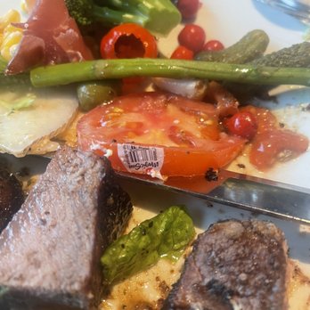 Fogo de Chão - Clearly they don't wash their produce or inspect it enough to catch this sticker. - Brazilian Near Me - Oak Brook, Illinois