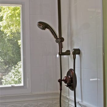 Greg Norman & Associates, Inc. - a shower head and hand shower - General Contractors Near Me - Annandale, Virginia Greg Norman & Associates, Inc. - a shower head and hand shower - General Contractors Near Me - Annandale, Virginia
