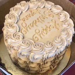 Amaretto icing with gold dusting. Vanilla layer cake with custard and rum cream